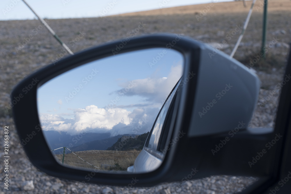 mountains with clouds in reflection