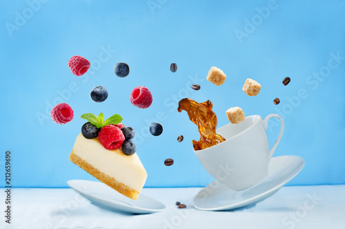 Flying cup of coffee with cheesecake