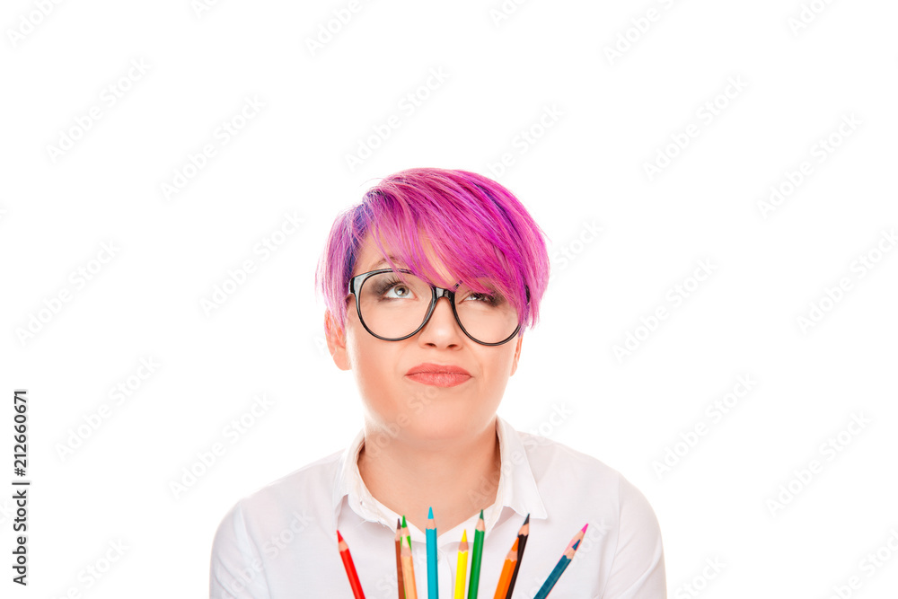 Pensive woman with pile of coloring pencils