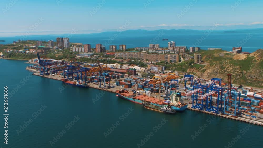 Port cranes move cargo containers Port cranes move cargo containers