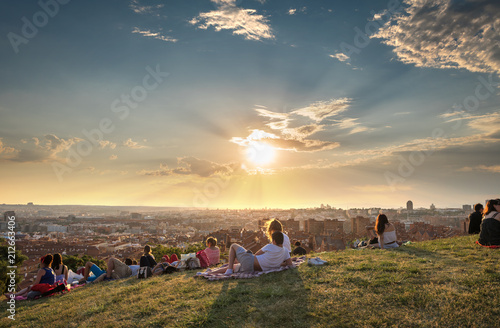 Madrid fantastic shine - boys and girls watching the skyline in the sunset of Madrid