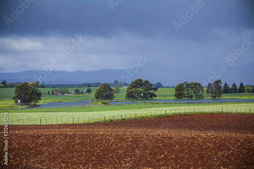 Ploughed farmland with approaching storm