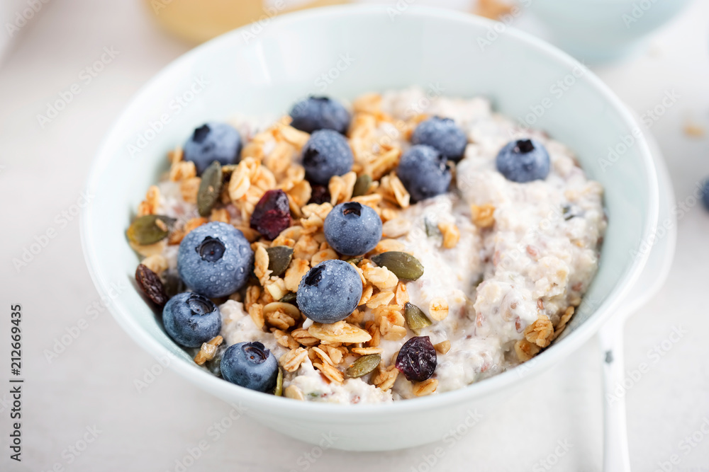 Oats with granola, dried cranberries, pumpkin seeds and blueberries Oats with granola, dried cranberries, pumpkin seeds and blueberries