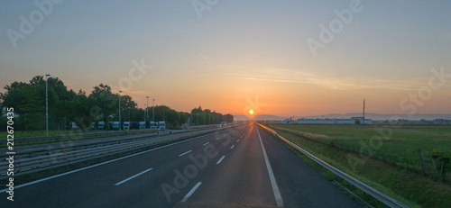Panoramic background of motorway at sunrise