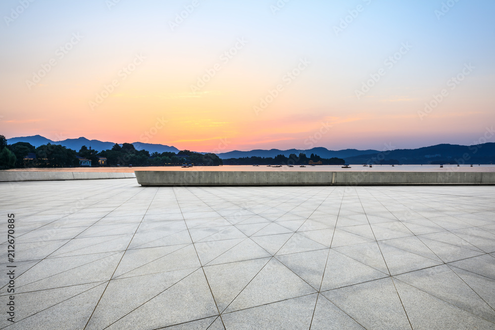 Empty square floor and hill silhouette at dusk