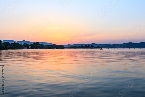 Beautiful lake and hill landscape at sunset