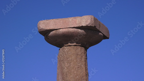 Antique column on blue sky background
