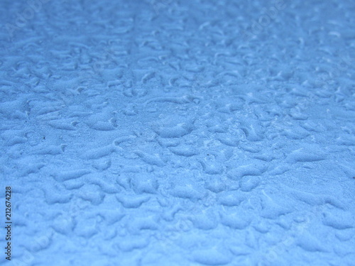 A close up of water droplets on a vehicle 