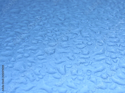 A close up of water droplets on a vehicle 