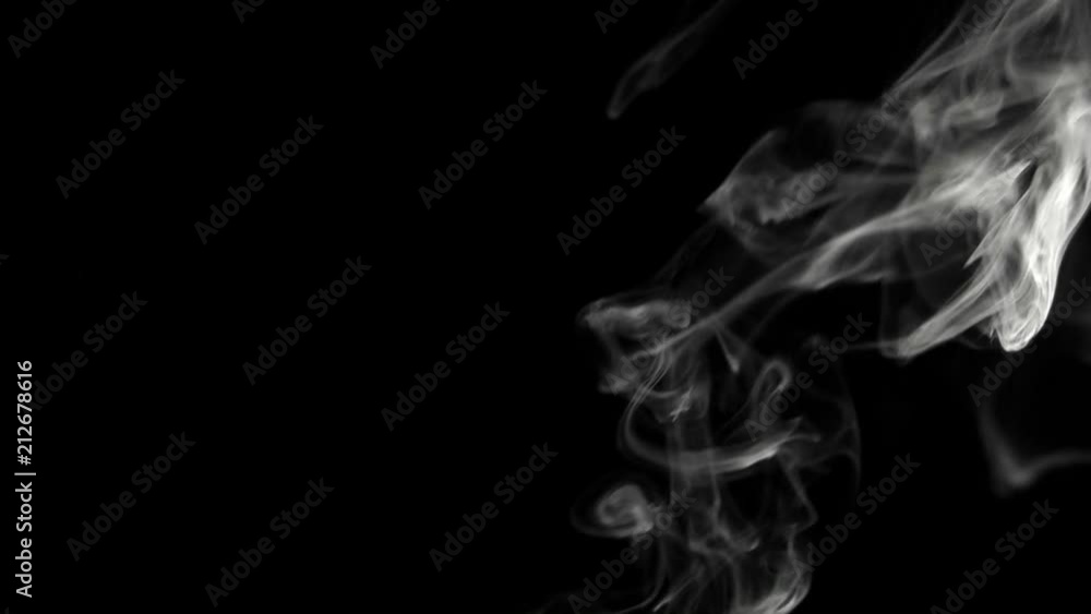 Blurry smoke on black background with space for text on the left Blurry smoke on black background with space for text on the left