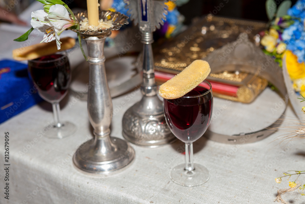 Glass of wine and cookie used in the orthodox marriage ceremony