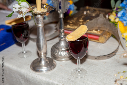 Glass of wine and cookie used in the orthodox marriage ceremony