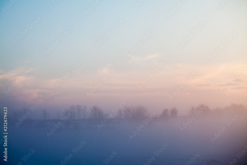 Countryside winter landscape at sunset

