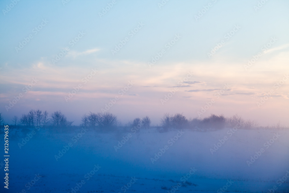 Countryside winter landscape at sunset
Countryside winter landscape at sunset