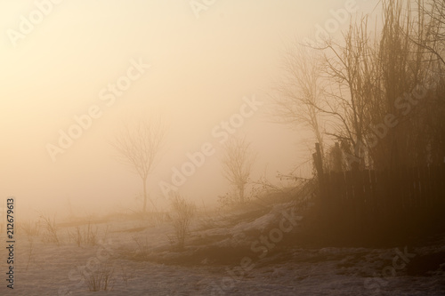 Countryside winter landscape at sunset 
