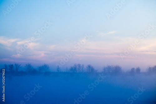 Countryside winter landscape at sunset 