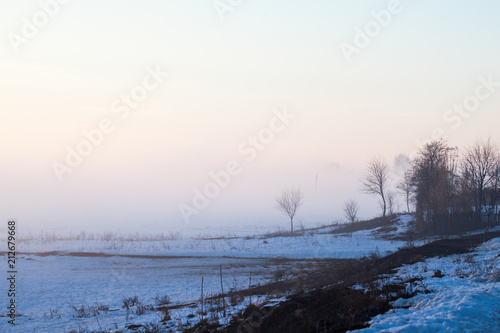 Countryside winter landscape at sunset  