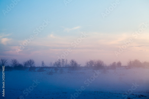 Countryside winter landscape at sunset 