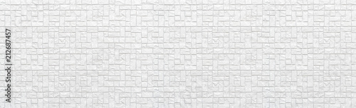Panorama of Modern white stone tile wall pattern and background