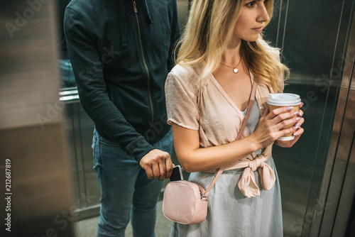 Quadro su tela robbery pickpocketing smartphone from womans bag in elevator