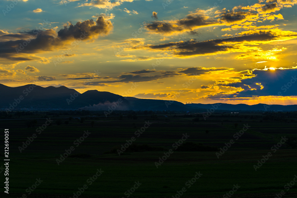 Obraz premium Dramatic Clouds at the sunsdet