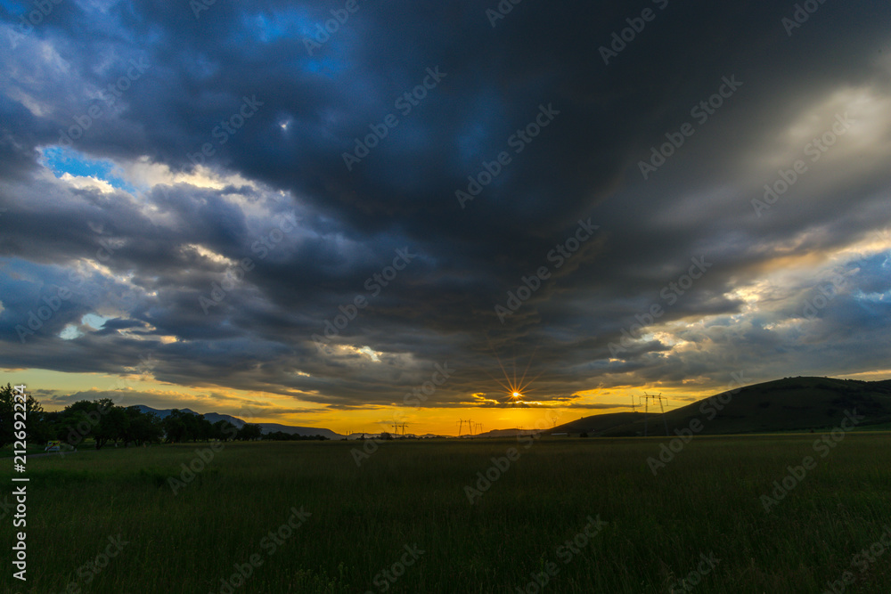Storm clouds at the sunset in the summer Storm clouds at the sunset in the summer