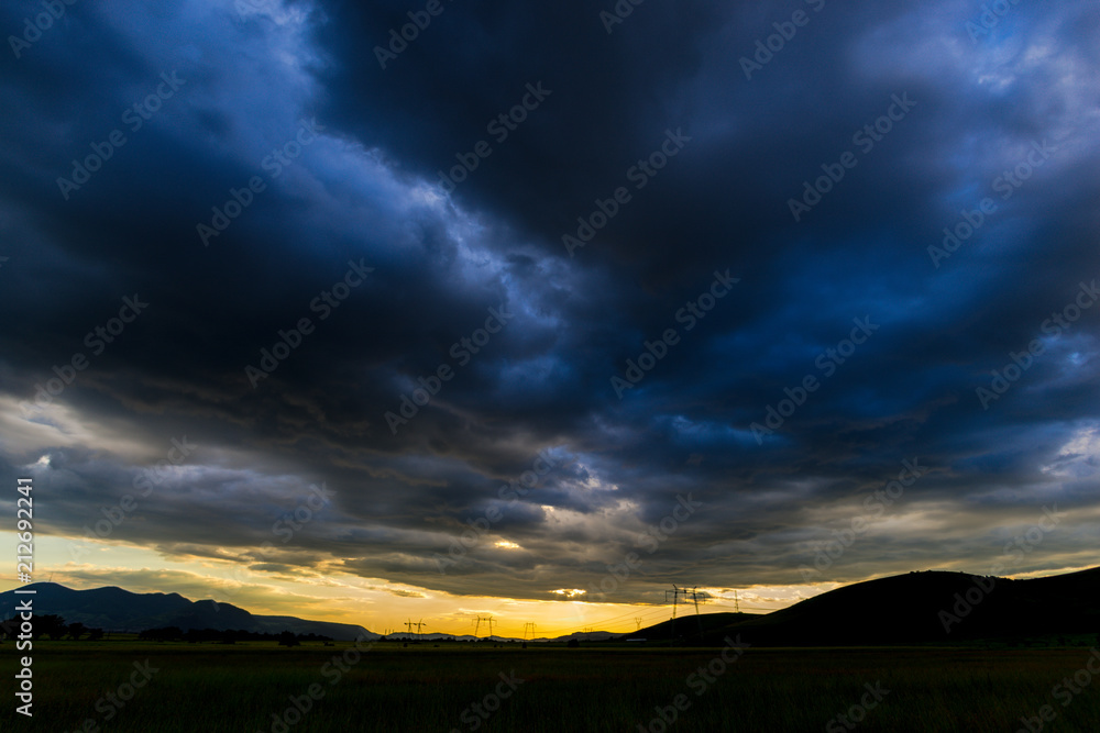 Storm clouds at the sunset in the summer Storm clouds at the sunset in the summer