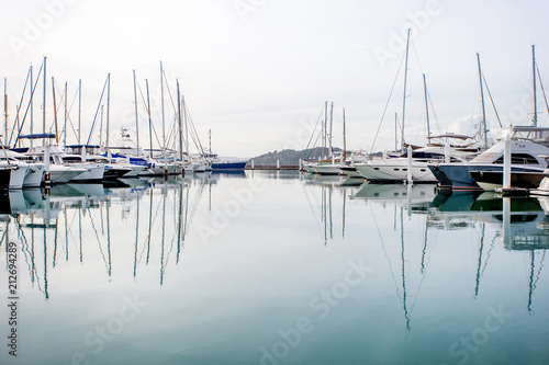 Yachts parking in harbor at sunset, Harbor yacht club in Thailand © Tawanboonnak