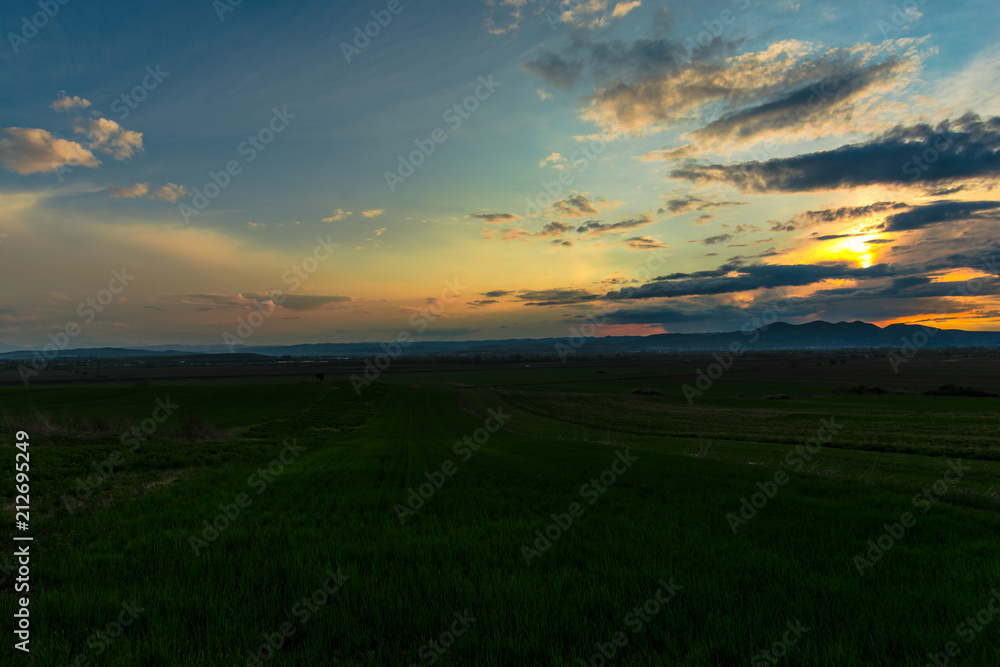 sunset over the field sunset over the field
