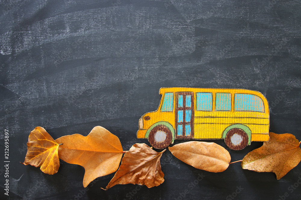 Back to school concept. Top view image school bus over autumn dry leaves classroom  blackboard background. Stock Photo | Adobe Stock