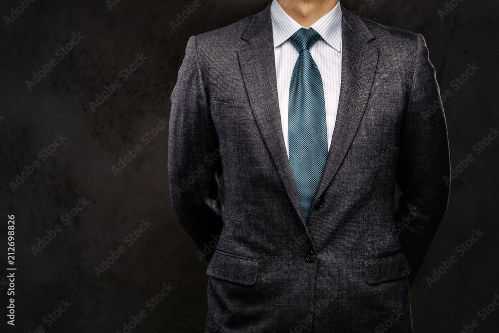 Cropped portrait of a successful businessman dressed in an elegant formal suit. Cropped portrait of a successful businessman dressed in an elegant formal suit.