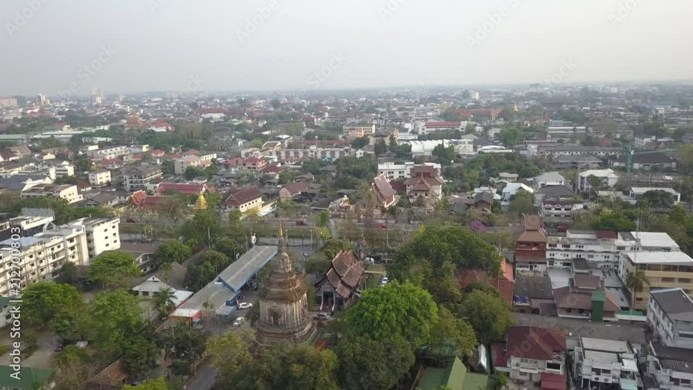 4K AERIAL SIDEWARDS VIEW flying over the city of Chiang Mai, Thailand. Wat Lok Moli Temple. 4K AERIAL SIDEWARDS VIEW flying over the city of Chiang Mai, Thailand. Wat Lok Moli Temple.