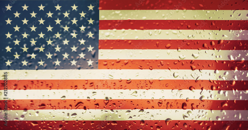 Texture of the USA flag on the glass with drops of rain at dawn. Texture of the USA flag on the glass with drops of rain at dawn.