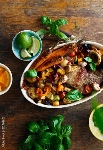 Fotografija Beef meat baked vegetables ceramic pot wooden background top view