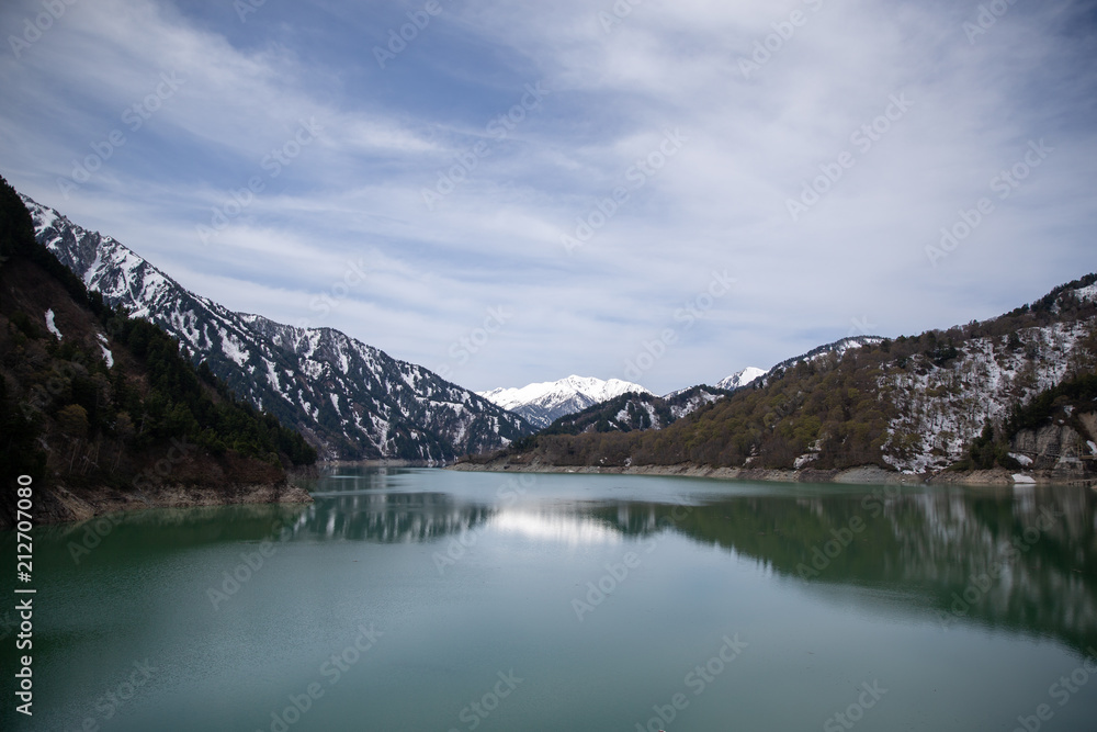 Scenery of lake and mountains from Kurobe Dam in Tateyama Kurobe Alpine Route, Japan