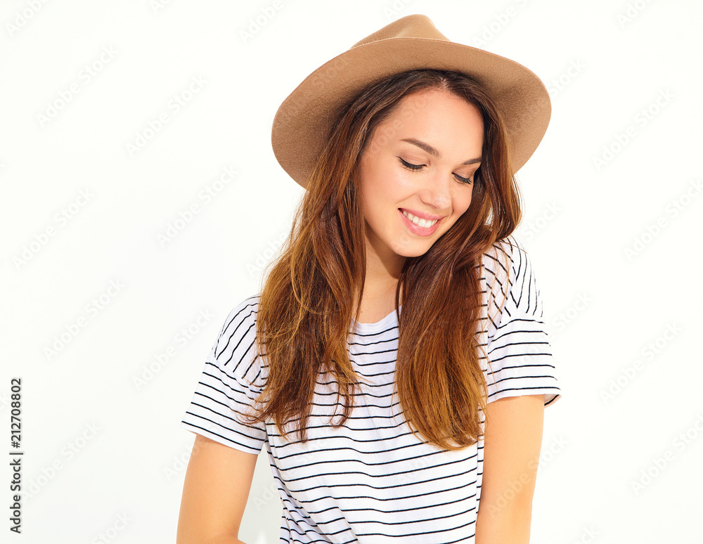 Portrait of young stylish girl model in casual summer clothes in brown hat with natural makeup isolated on white background Portrait of young stylish girl model in casual summer clothes in brown hat with natural makeup isolated on white background