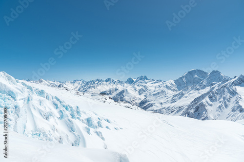 Winter snow covered mountain peaks in Caucasus. Great place for winter sports