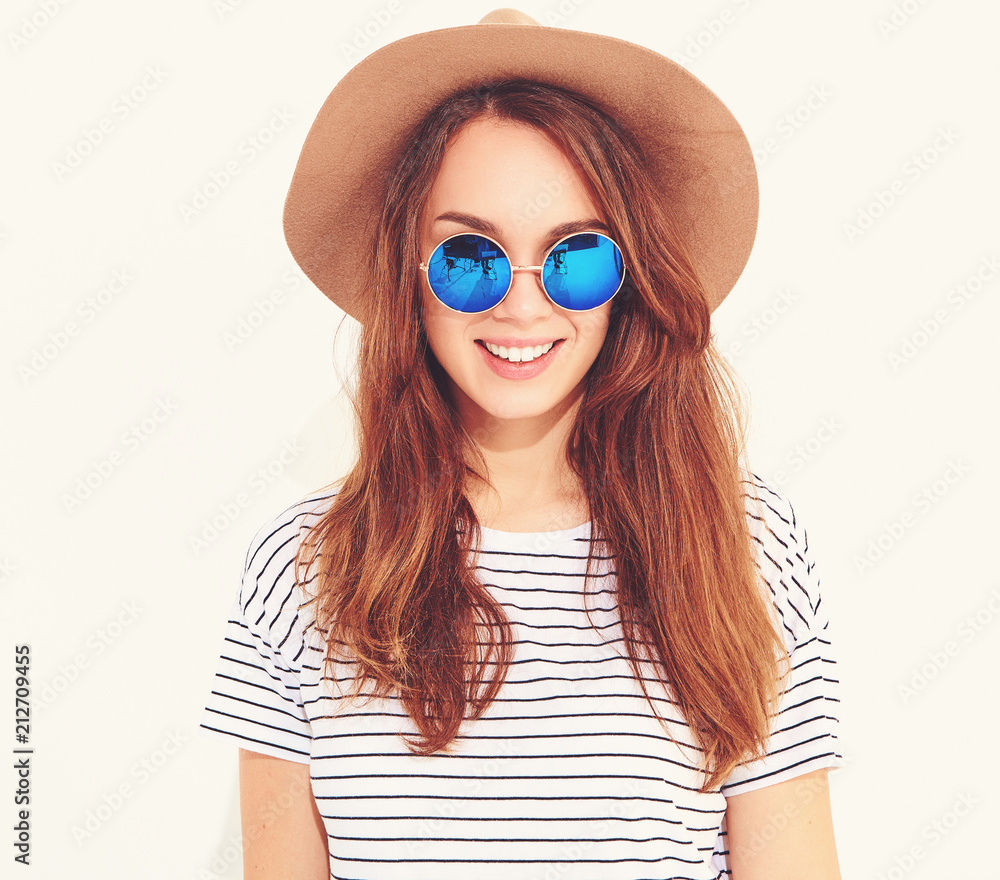 Portrait of young stylish laughing girl model in casual summer clothes in brown hat isolated on white background Portrait of young stylish laughing girl model in casual summer clothes in brown hat isolated on white background