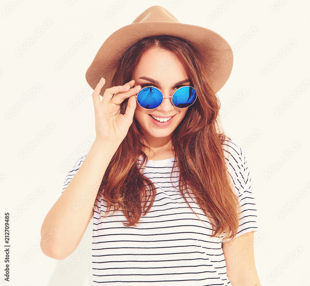 Portrait of young stylish laughing girl model in casual summer clothes in brown hat isolated on white background Portrait of young stylish laughing girl model in casual summer clothes in brown hat isolated on white background