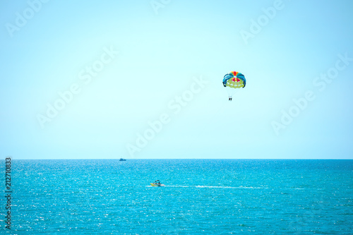 ??rasailing, parachute over the sea flying behind the boat