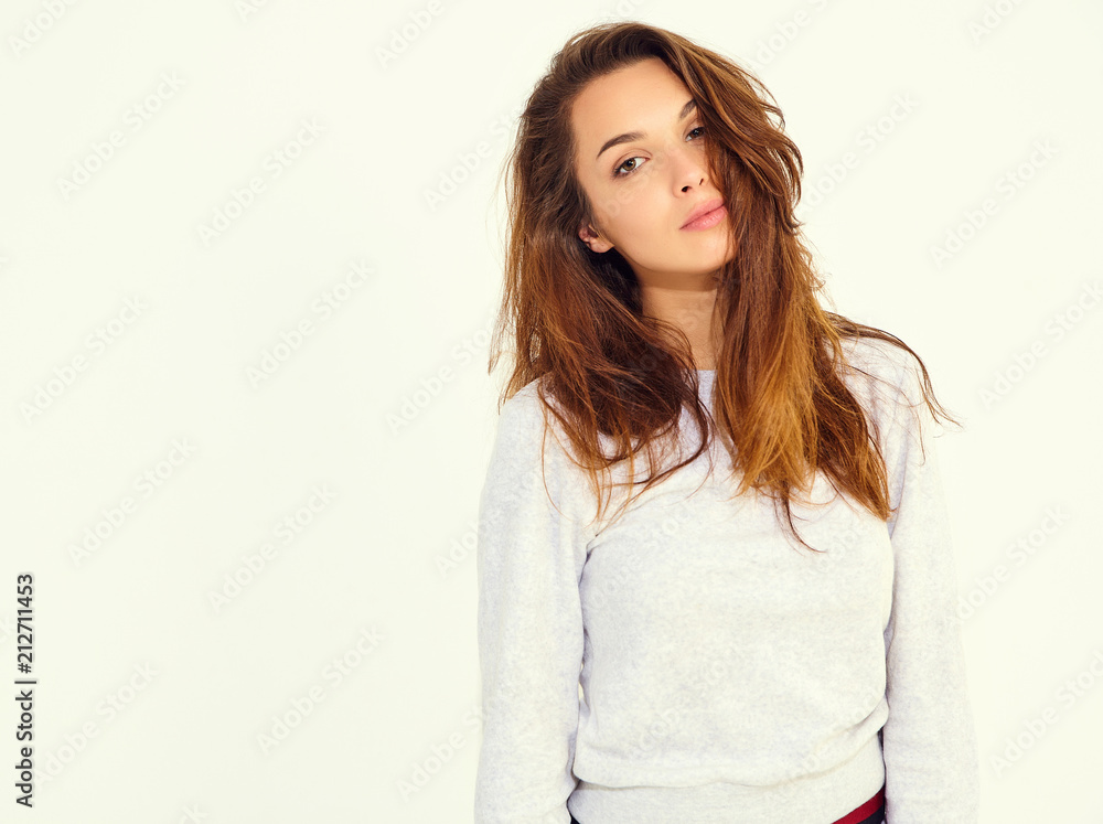 Portrait of young stylish cute girl model in casual gray sport costume with natural makeup isolated on white background Portrait of young stylish cute girl model in casual gray sport costume with natural makeup isolated on white background