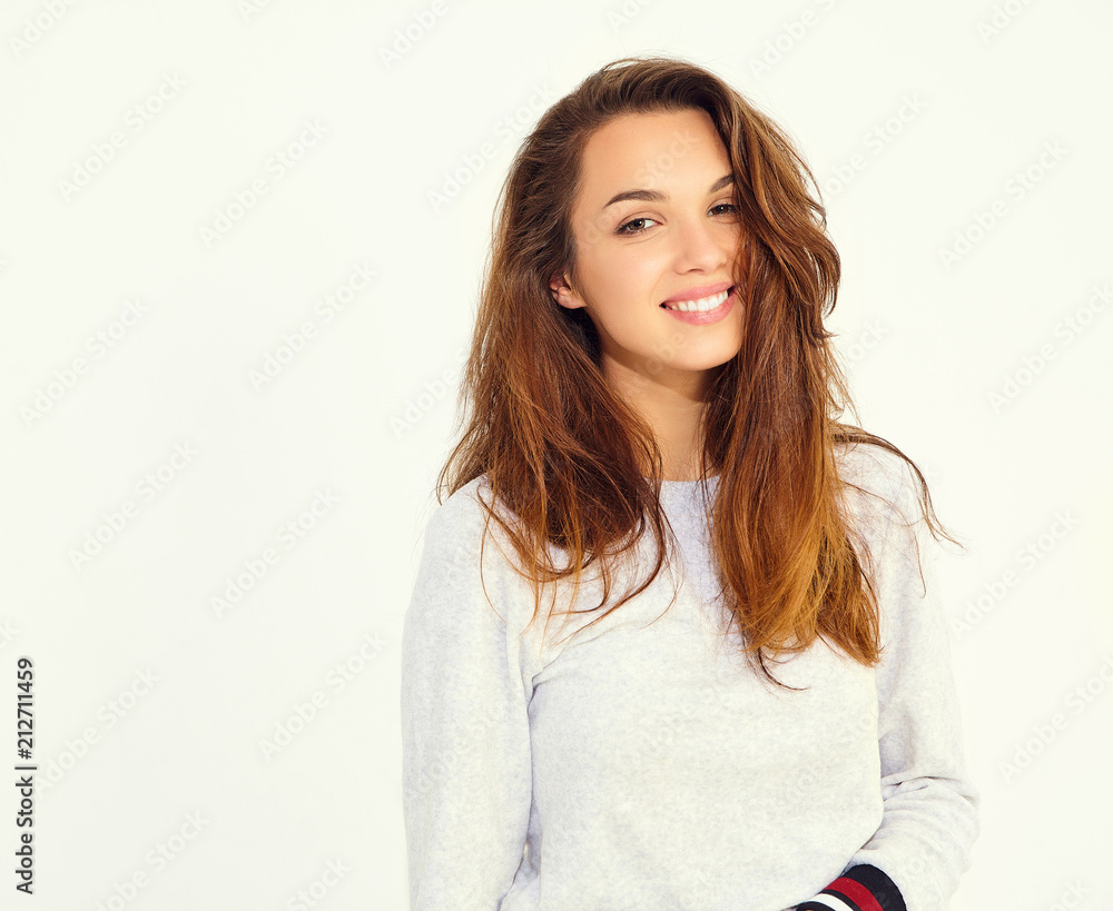 Portrait of young stylish cute girl model in casual gray sport costume with natural makeup isolated on white background Portrait of young stylish cute girl model in casual gray sport costume with natural makeup isolated on white background