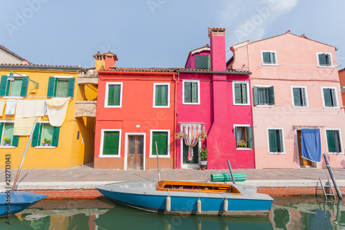 Rectilinear view of the colored facades of buildings on the island of Burano, near Venice, Italy