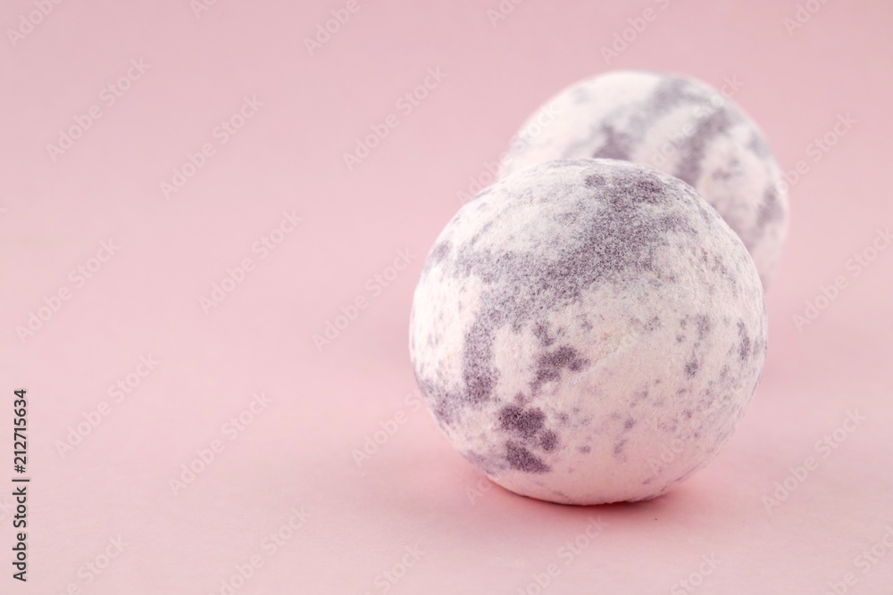 Lavender bath bombs on a gently pink background.Aromatherapy and body cosmetics.natural vegan organic body cosmetics Lavender bath bombs on a gently pink background.Aromatherapy and body cosmetics.natural vegan organic body cosmetics