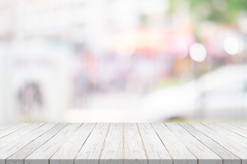 white wood table top on blurred background from shopping mall, Space for montage your product
