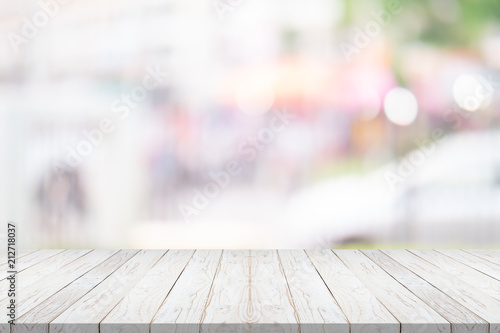 white wood table top on blurred background from shopping mall, Space for montage your product