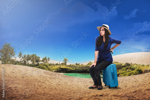 Pretty asian tourist woman with suitcase