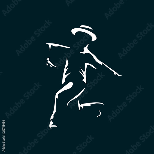Jazz dancer in the dark with light on his silhouette.
