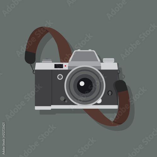 Retro camera in a flat style with strap photo