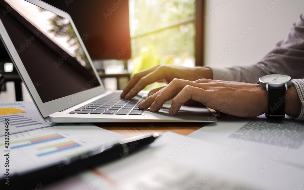 close up of businessman working on laptop do strategy to development profit. close up of businessman working on laptop do strategy to development profit.